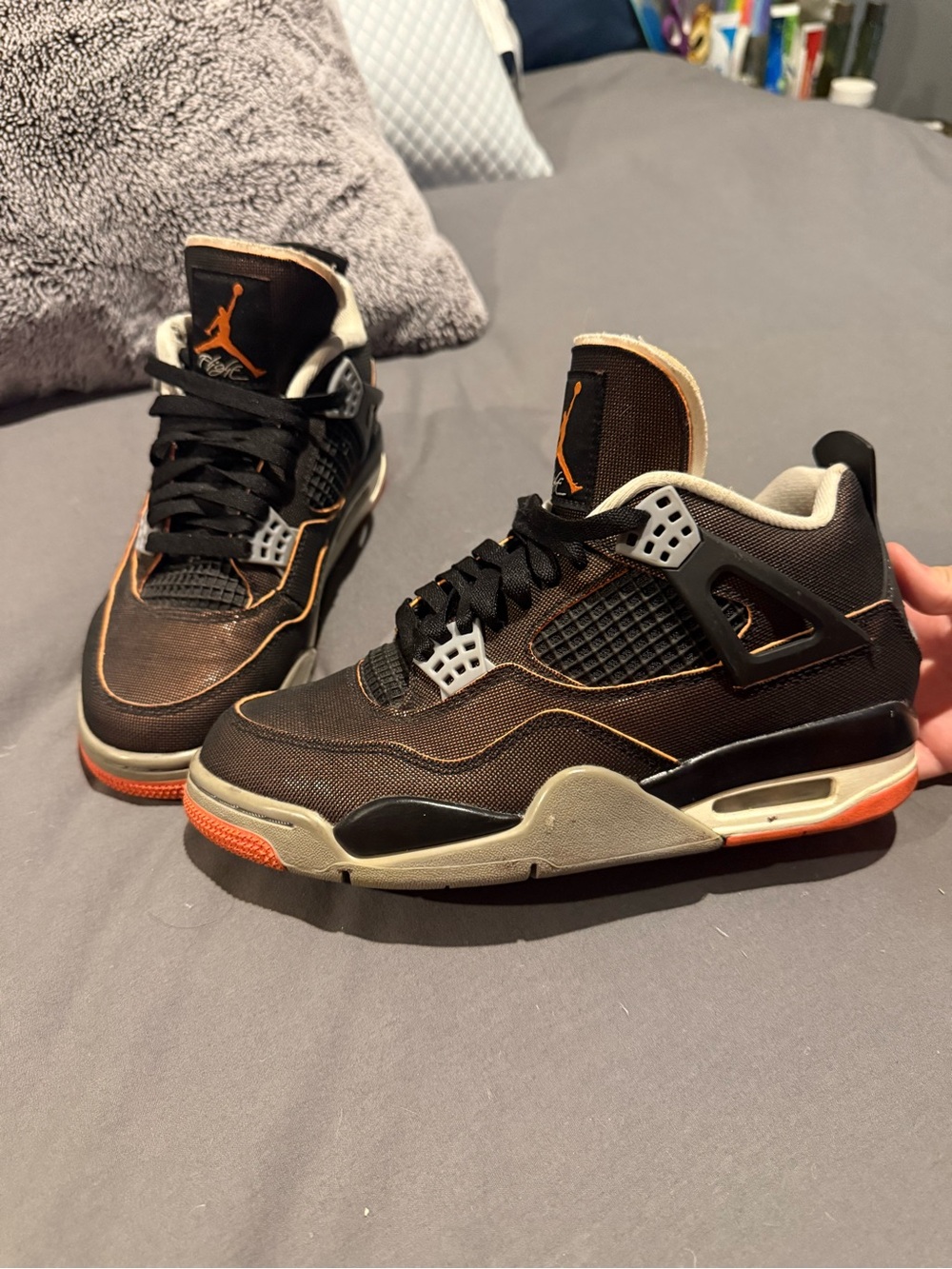 Jordan women’s Sneakers in Black and Orange Accent